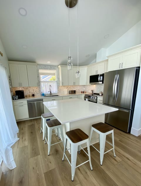Beautiful custom kitchen, quartz countertops, fully equipped to serve 12 people.