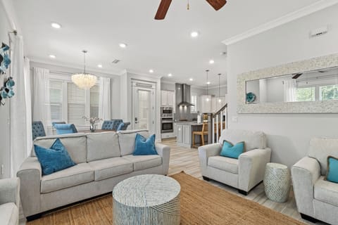 View of newly renovated living room (w/ queen sleeper, dining, & kitchen 