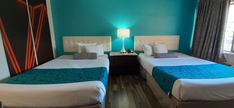 Room, 2 Queen Beds, Non Smoking | Desk, laptop workspace, blackout drapes, iron/ironing board