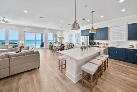 Step into your stunning ocean-view retreat where modern comfort meets coastal elegance. This open-concept space flows seamlessly from kitchen to living areas.