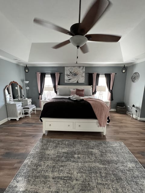 Master bedroom. King size bed with sitting area and desk