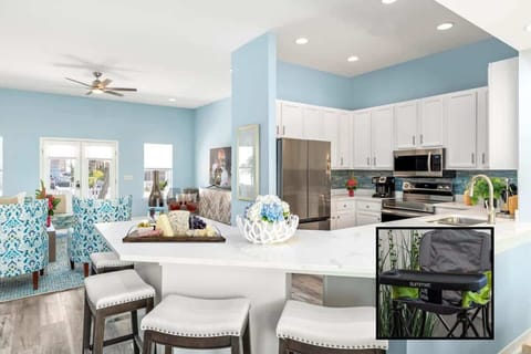 Enjoy a spacious and stylish kitchen with quartz countertops and brand-new stainless-steel appliances. Relax on the comfy bar stools or mingle in the open living and dining area. A perfect place for cooking and socializing.