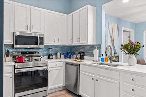 Prepare delicious meals in a sleek kitchen with a dishwasher and a full set of utensils. You'll have everything you need for a comfortable stay.