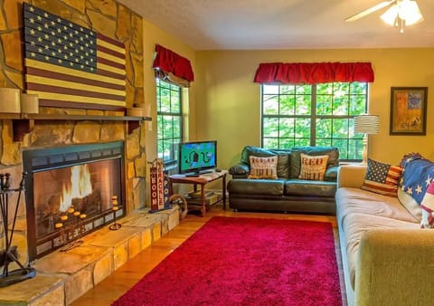 Cozy living area with fireplace and sleeper sofa.