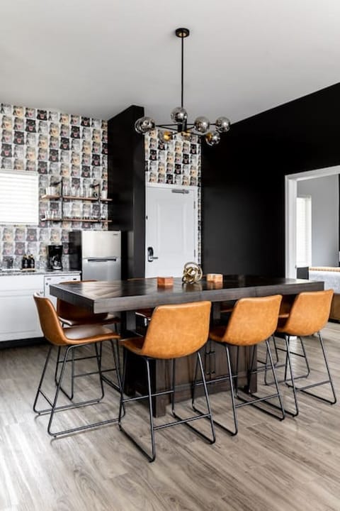 Fully equipped kitchen with drip coffee maker + coffee. Dining table with seating for 8. Full length mirror for getting ready. This room opens up into the living room. Unique wallpaper all throughout the condo.