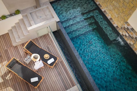 Outdoor pool, open 9:00 AM to 9:00 PM, sun loungers