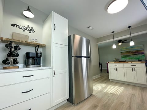 Start your day with a cup of coffee from the fully stocked coffee bar