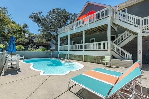 Private pool with plenty of lounge seating and easy access to the home’s decks