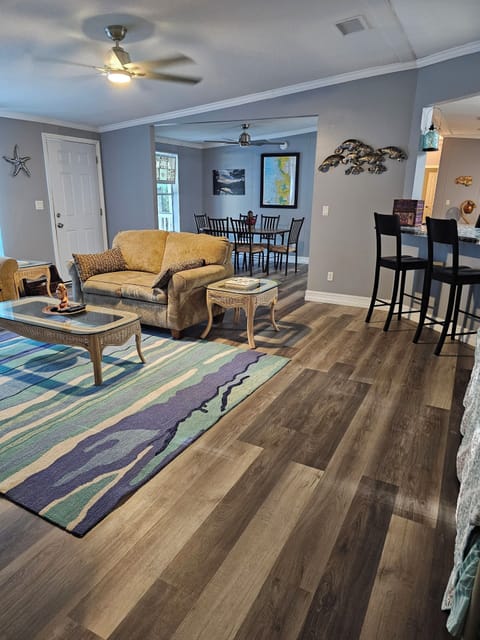 Living room view from master bedroom, kitchen to the right