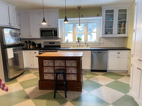 Kitchen is fully stocked with silverware, dish-ware, and basic cookware 