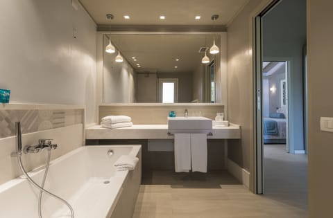 Combined shower/tub, eco-friendly toiletries, hair dryer, bathrobes