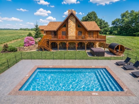 Welcome to Serenity Log House, featuring a private heated seasonal pool!