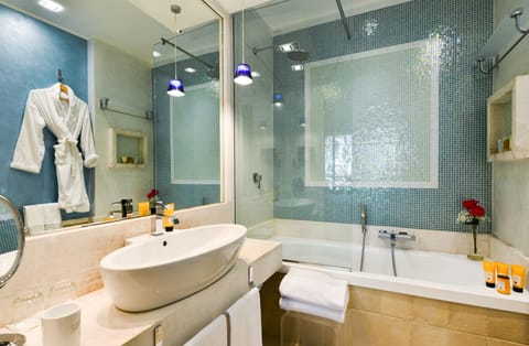 Eco-friendly toiletries, hair dryer, bathrobes, slippers