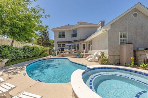 Pool and hot tub with patio and property exterior