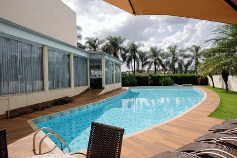 Outdoor pool, open 7:00 AM to 10:00 PM, sun loungers
