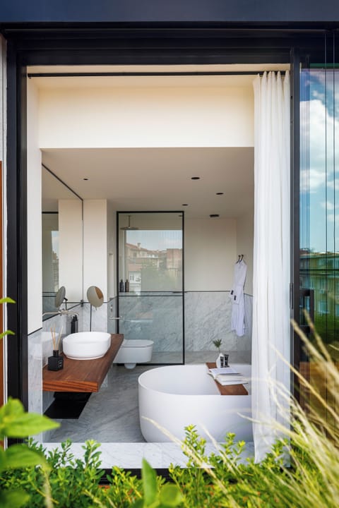 Rainfall showerhead, designer toiletries, hair dryer, bathrobes