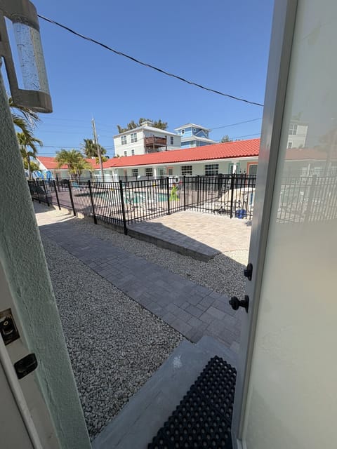 View of pool and courtyard from back kitchen door