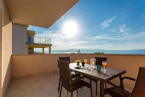 TerraceSpacious terrace with a breathtaking view of the sea and Kvarner Bay, perfect for relaxing and enjoying nature.