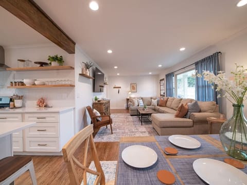 The view from the kitchen island bar / dining area into the living room.