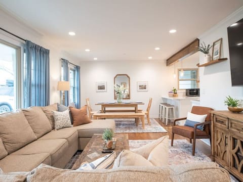 The view from the front door in the living room towards the dining room and kitchen island.