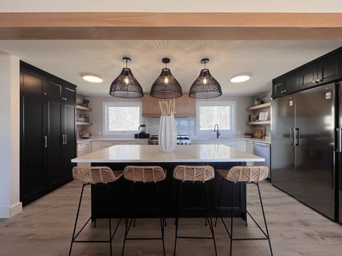 Giant 10’x4’ quartz island allow for the space needed for cooking & hanging out