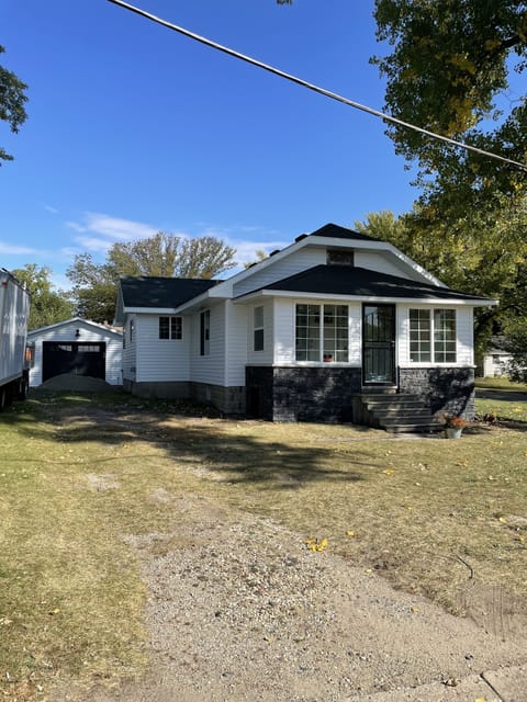 Freshly renovated exterior with a large driveway for your big rig and plug-ins.