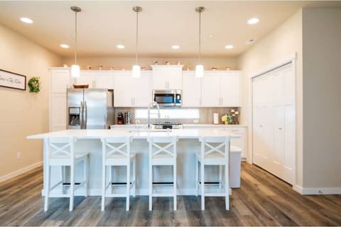 The kitchen has an island that seats up to 4 people