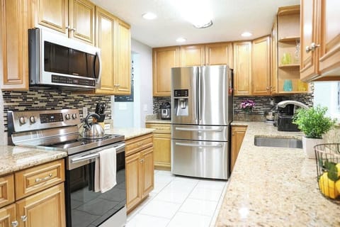 Fully equipped kitchen in our License to Chill, Largo vacation rental with heated pool.
