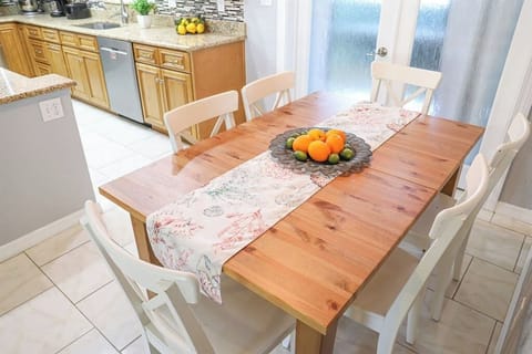 Dining room with seating for six in our License to Chill, Largo vacation rental with heated pool.