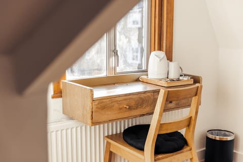 Desk, laptop workspace, free WiFi, bed sheets