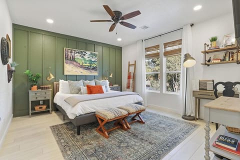 Tranquil master bedroom. The king sized bed has plenty of pillows providing guests with a restful sleep. Stay in bed and watch a movie on the 50 inch Roku TV.  