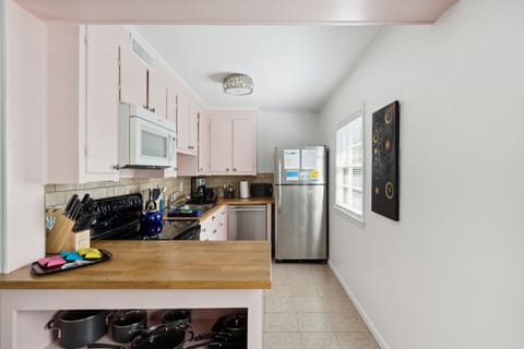 This home has vantage cabinets stocked with all the cookware, serving dishes and utensils you will need to cook and serve meals. We also include small appliances such as blender, coffee maker and microwave.