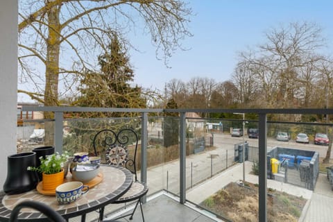 The balcony's stylish design complements the apartment's decor. 