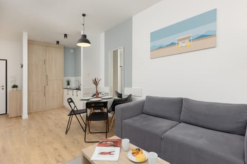 Relax in the stylish living room with a comfortable sofa and modern decor.