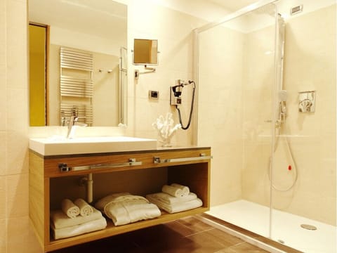 Shower, rainfall showerhead, hair dryer, towels