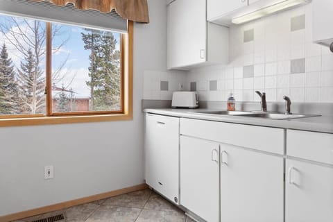 The kitchen is a light-filled space with a large window providing some tranquil views while you prepare your meal.