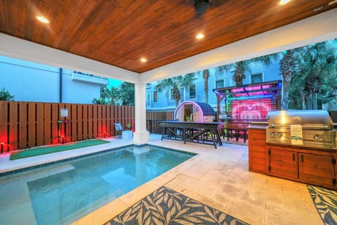AT YOUR LEISURE by Great Escapes Homes includes 6 bedrooms, private covered pool, sauna, bar/gazebo, gas grill, grass yard, and more!