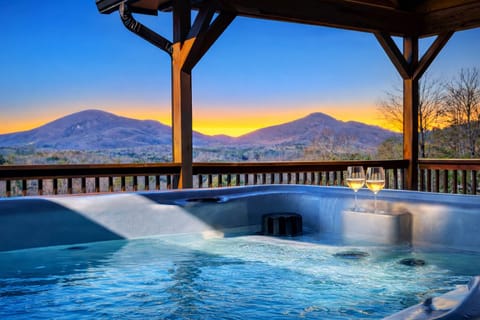 Soak in the hot tub while taking in breathtaking mountain sunset views—your front-row seat to pure relaxation and unforgettable moments.