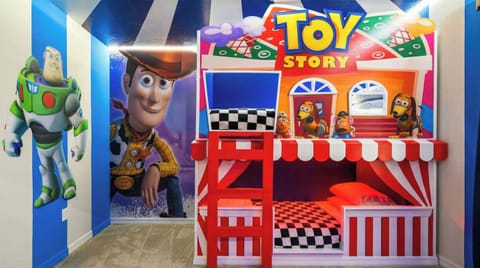 Toy Story bunk room with carnival flair, custom beds, and larger-than-life characters.