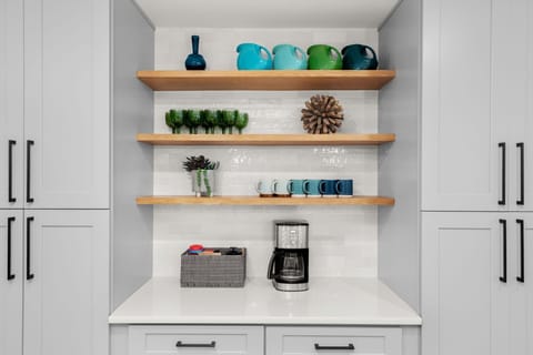 Whip up the drink of your choice at the convenient bar, coffee, and pantry area.