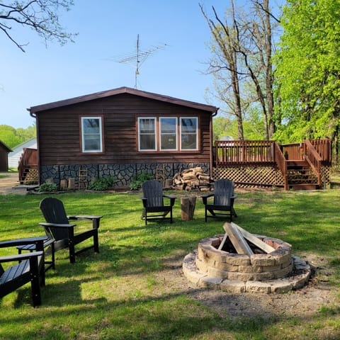 Back yard with firepit and lake entrance