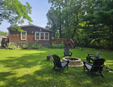 Back yard with firepit, lighting and access to pier 