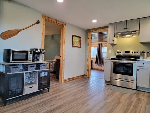 Kitchen has a microwave/coffee bar with a spot to store the grown-up drinks too!