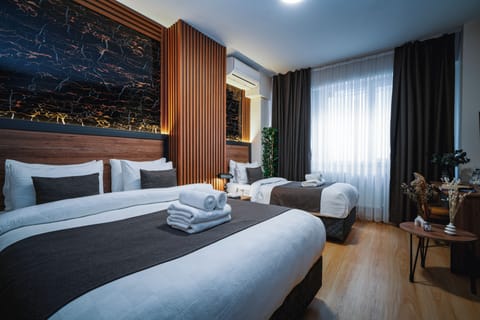 Economy Triple Room | Frette Italian sheets, premium bedding, Select Comfort beds