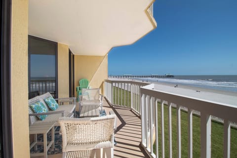 Relax on your private oceanfront balcony with stunning beach views and comfortable seating perfect for morning coffee or sunset cocktails.