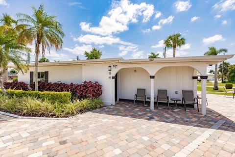 Charming exterior entrance offering a peaceful outdoor seating experience.