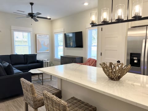 Open floor plan- Kitchen island with seating for 4 and dual zone wine fridge