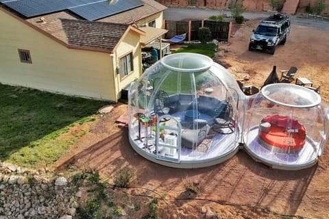 4 bedroom house with 2 glamping domes. The domes has a heater and AC inside. 