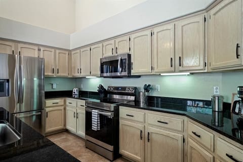 The large kitchen is perfectly stocked for your delectable meals.