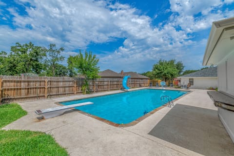 10 feet deep, 1500 square foot pool! With diving board and waterslide.
